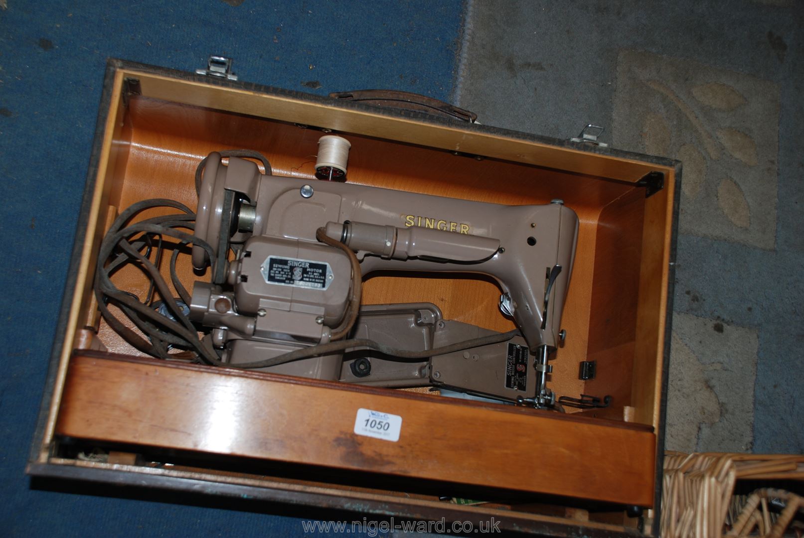 A cased Singer Sewing Machine