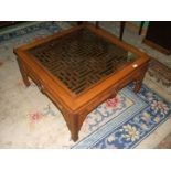 An Oriental hardwood lattice under glass top, opium style Lounge Table,