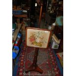 A Victorian Mahogany Pole Firescreen with floral embroidered panel