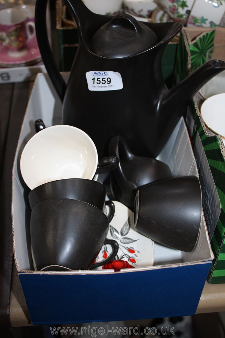 A vintage Midwinter Stylecraft Coffee Set including six black cups,