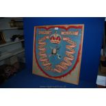 A framed Woolwork Picture depicting The Shield of the 4th Queen's Own Hussars,