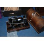 A Singer Sewing Machine in wooden case