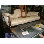 A Victorian Mahogany show frame Salon Settee, carved back rail, scroll end arms,