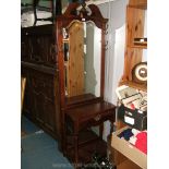 An Italian style Cherry finished Hallstand with swan neck pediment,