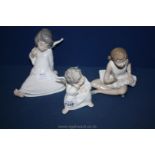 Two Lladro angel figures and a Nao Ballerina figure