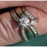 An Exquisite Canadian Diamond Bridal Set of Three Interlocking Rings (Size M) Comprising: A