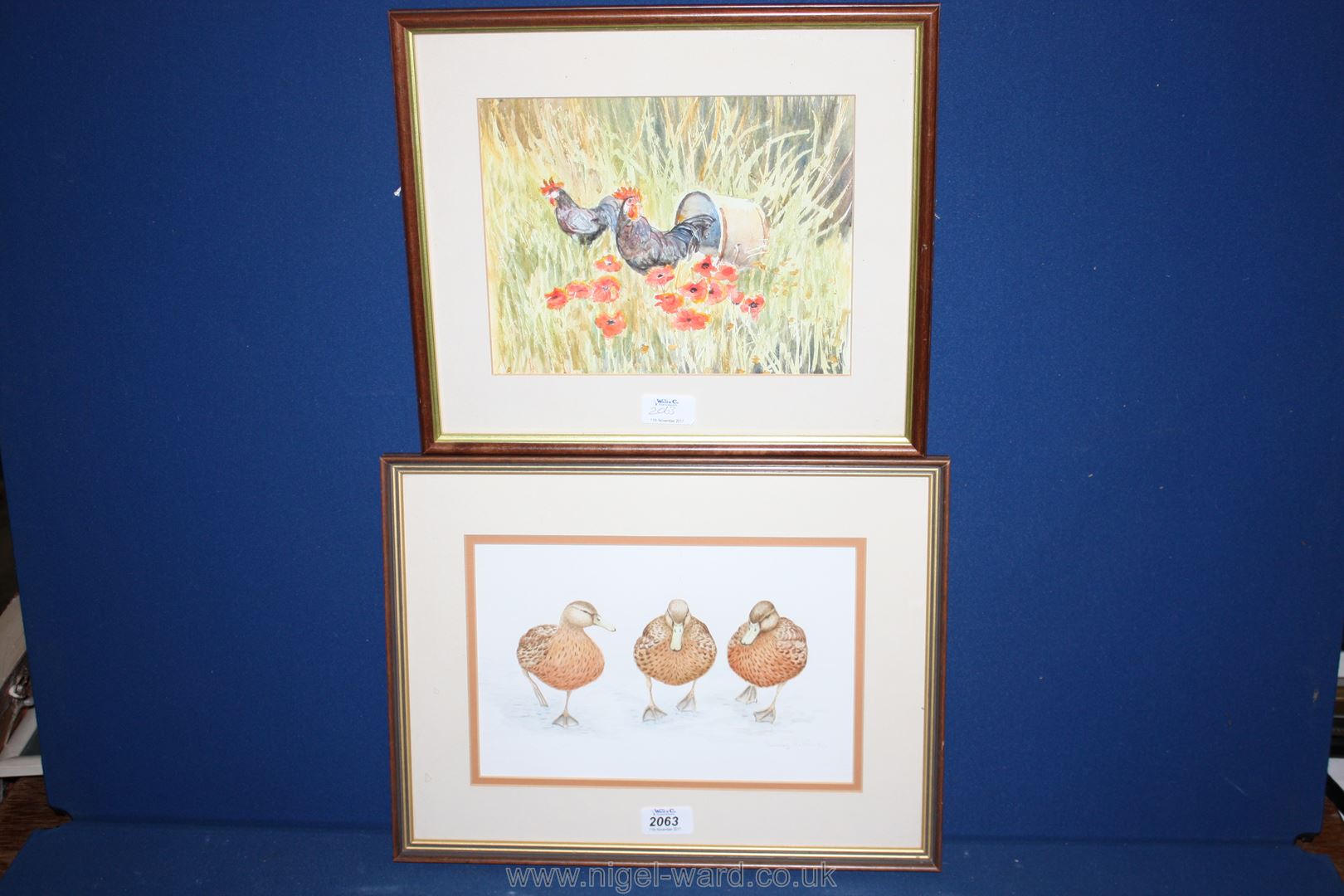 A framed and mounted Watercolour depicting Cockerels, statement verso D. E.