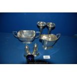 A pair of silver plated rose vases and silver plated sugar bowl, milk jug and salt,