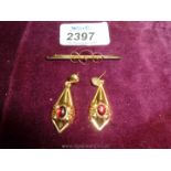 A 9ct Gold bar Brooch and a pair of hollow 9ct Gold Earrings with cabuchon garnets