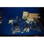 A quantity of plated and other cutlery including ladle, teaspoons, boxed Apostle spoons,