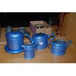 A blue teapot, sugar bowl,