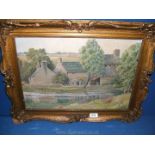 A framed Oil on board of a house by a river, signed C.E.