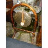 A Brass Dinner Gong on stand, 37'' overall,