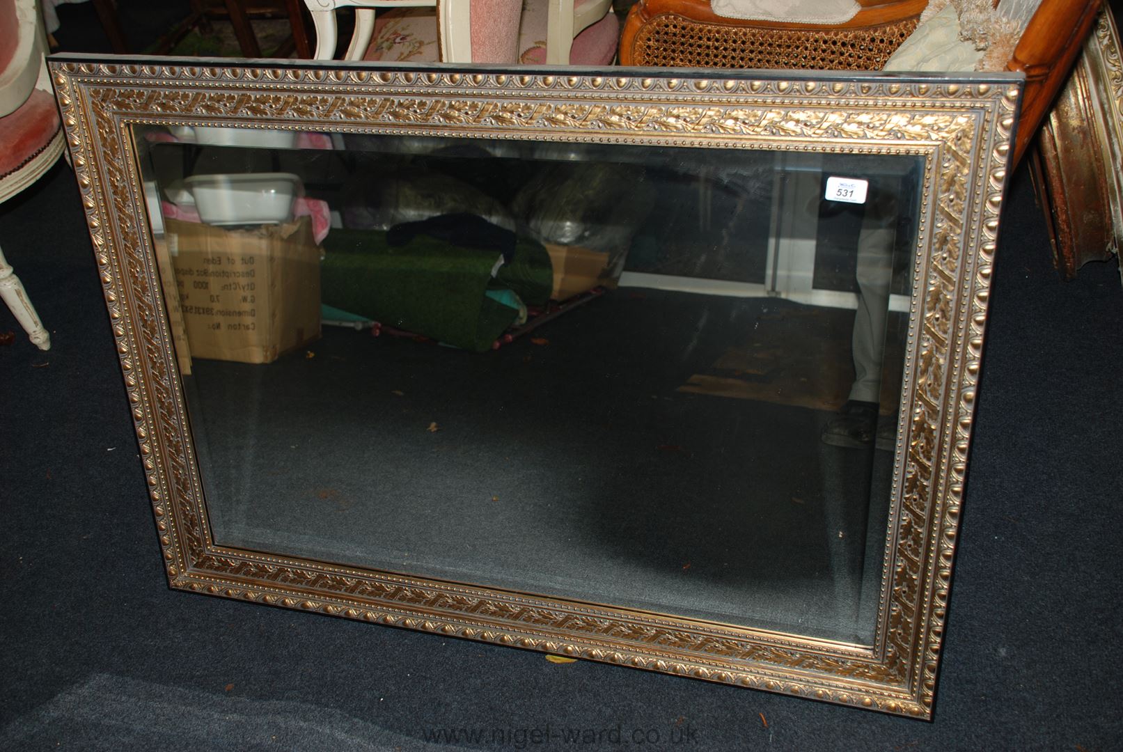 A modern Wall Mirror in gilt coloured decorative frame,