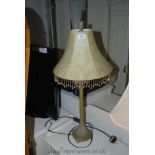 A modern Table Lamp with parchment style fringed shade