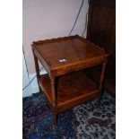 A burr Walnut two tier Night Stand on turned legs with small castors and slide out leaf,