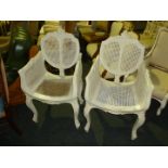 A pair of white painted French Armchairs with cane seat,