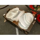 A quantity of large white ovenproof dishes