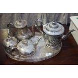 An oval silver plated galleried Tray with three Teapots and Coffee Pot