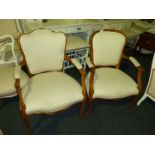 A pair of modern upholstered French style Elbow Chairs.