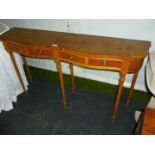 A modern four drawer serpentine fronted Yew wood Console Table with six legs, 50" long.