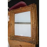 An antique carved giltwood Mirror,