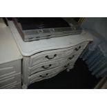 A modern French style, white painted, serpentine fronted, three drawer Chest of Drawers,