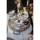 Two handled circular plated Tray with two plated Teapots and Coffee Pot