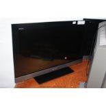 A Sony 31'' Television and remote control