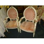 A pair of painted modern French style upholstered Elbow Chairs.