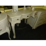 A modern white painted three drawer serpentine fronted Dressing Table, 35 1/4" wide.