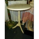 A modern white painted Tripod Table with fluted column.