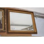 A Wall Mirror with silver/gilt coloured frame, 29'' x 25 1/2''.