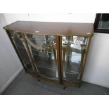 A DECORATIVE RETRO DISPLAY CABINET