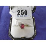 18ct GOLD RING SET WITH RED GEM STONE