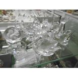 SMALL COLLECTION OF SWAROVSKI GLASS IN A CABINET