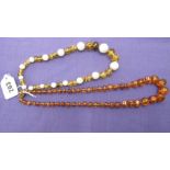 TWO AMBER NECKLACES,