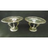 A PAIR OF SMALL SILVER TAZZA'S ON DRAGON SUPPORTS