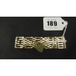 A 9CT GOLD GATE BRACELET,