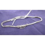 A WHITE METAL AND DIAMOND LINE BRACELET STAMPED 18K, TOTAL STONE WEIGHT APPROXIMATELY 2CT,