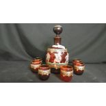 A HAND PAINTED VENETIAN RED GLASS DECANTER AND SIX GLASSES