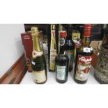 A MIXED ASSORTMENT OF WINES AND SPIRITS INCLUDING KUMMEL WOLFSCHMIDT AND BOTTLE OF CREME DE CASSIS