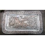 A SILVERED COPPER PERSIAN PLAQUE