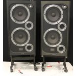 WHARFEDALE SPEAKERS - a pair of Wharfedale E45 speakers on modern mobile stands.