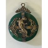 A CHINESE GREEN HARDSTONE DISC PENDANT - most probably jade,