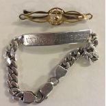 9CT BROOCH & SILVER IDENTITY BRACELET - brooch is part 9ct and weighs approx. 1.8g.