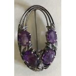 SILVER AMETHYST BROOCH - Arts & Craft brooch attributed to Bernard Instone and dating to c1925.