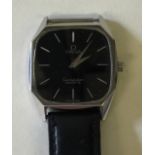 GENTS OMEGA CONSTELLATION - quartz watch with black dial and baton hour markers.