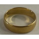 22CT GOLD WEDDING RING - with clear hallmarks for Birmingham. Weighs 3.7g. Size M/L.