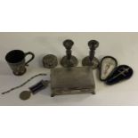 ASSORTED SILVER ITEMS - to include 2 candlesticks, cigarette box, a silver cup, bracelet, pin tray,